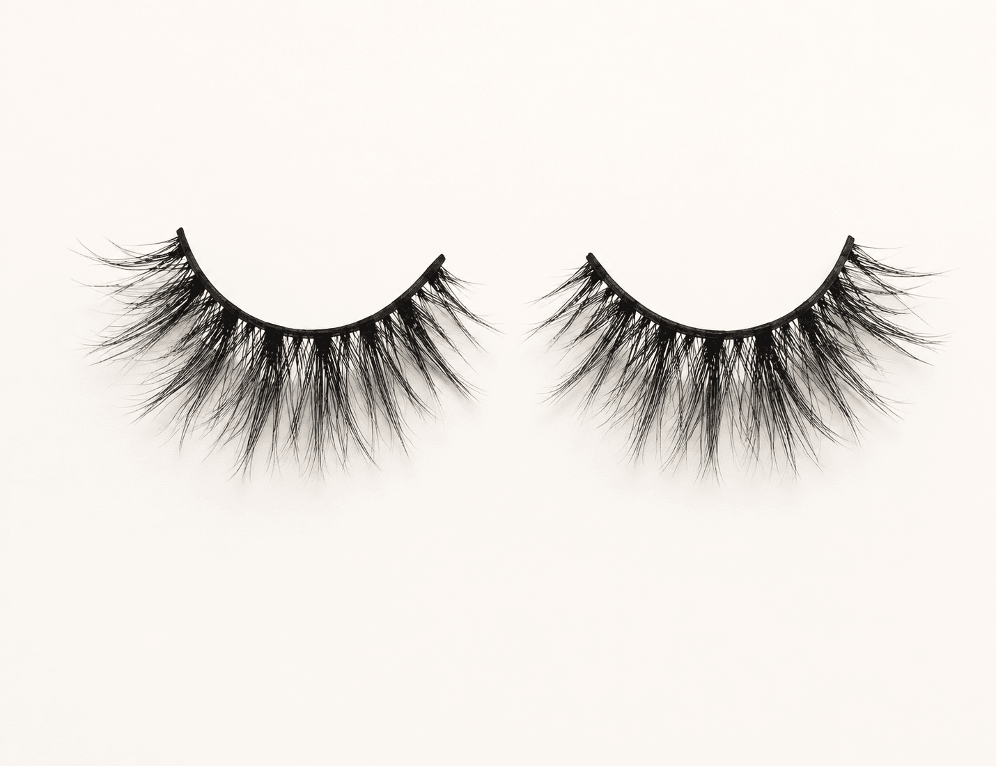 Unbranded wispy strip lashes on a clean studio background